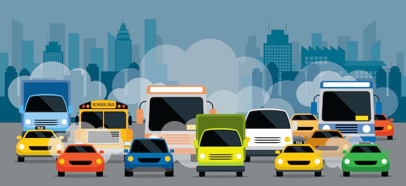 Vehicles in traffic in sunset