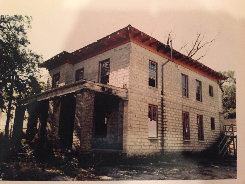 An old photo of the writer's 100-year-old house that she found in a drawer after they moved in.